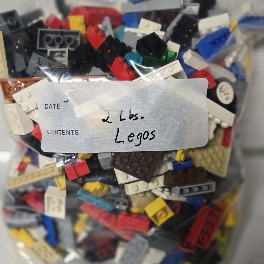 2 lbs of Lego brand building blocks.